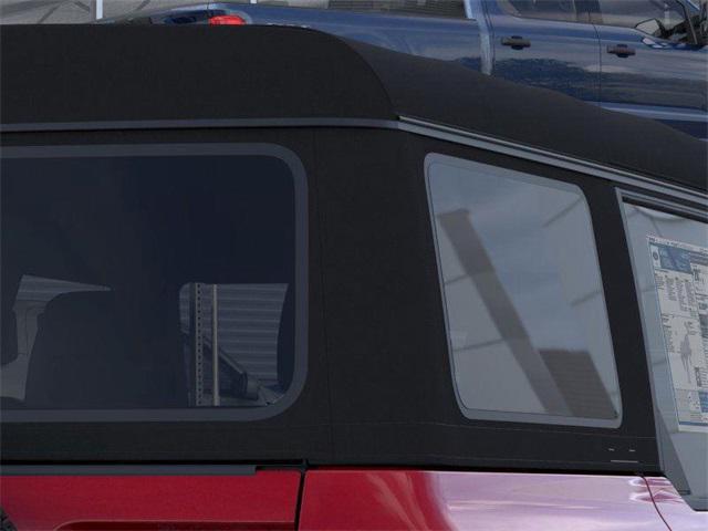 Photo of 2025 Ruby Red Metallic Tinted Clearcoat Ford Bronco