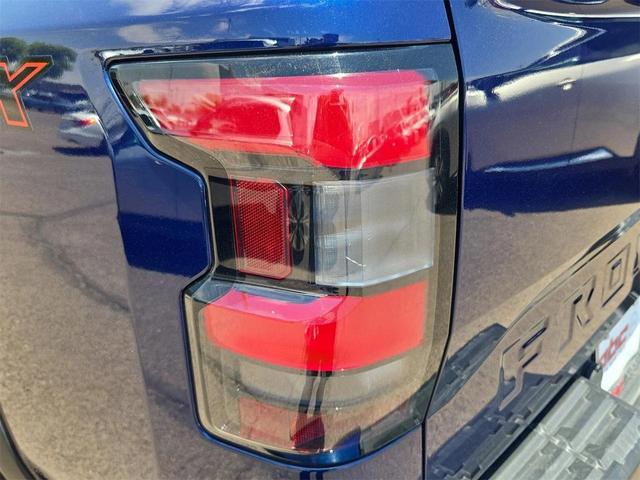 Photo of 2023 Deep Blue Pearl Nissan Frontier