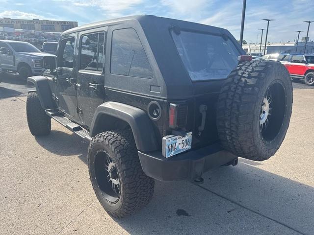 Photo of 2011 Black Clearcoat Jeep Wrangler Unlimited