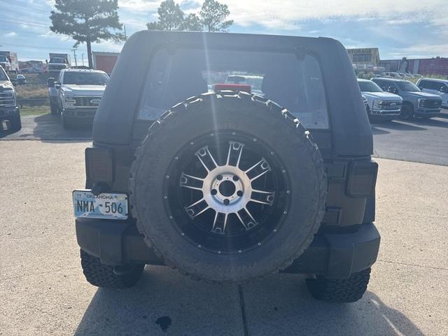 Photo of 2011 Black Clearcoat Jeep Wrangler Unlimited