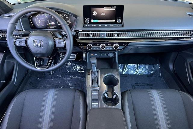 Photo of 2026 Blue Lagoon Pearl Honda Civic Hybrid
