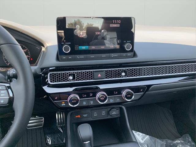 Photo of 2026 Crystal Black Pearl Honda Civic Hybrid