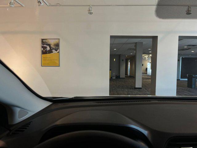 Photo of 2024 Aspen White Tricoat Nissan Versa