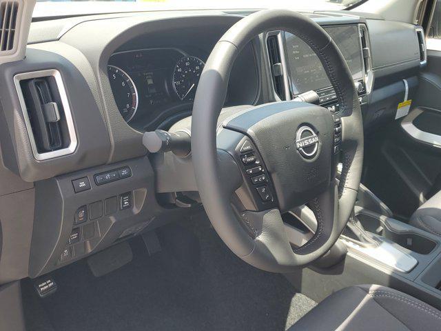 Photo of 2025 Glacier White Nissan Frontier