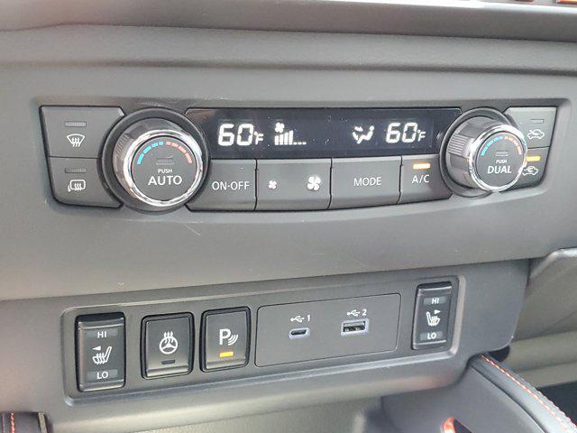 Photo of 2025 Afterburn Orange Nissan Frontier