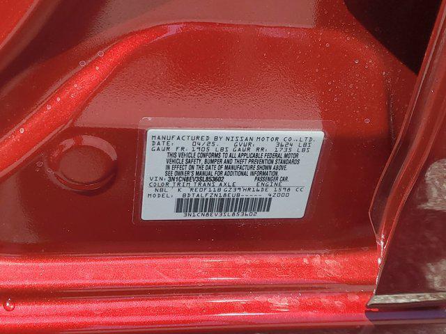 Photo of 2025 Scarlet Ember Tintcoat Nissan Versa