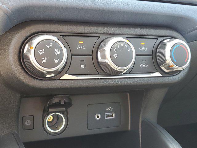 Photo of 2025 Scarlet Ember Tintcoat Nissan Versa