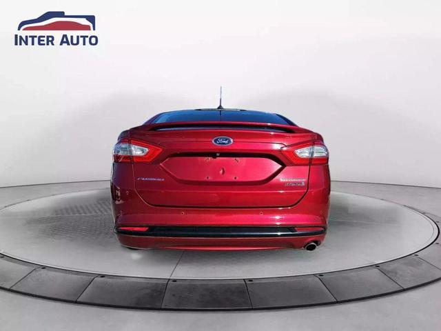 Photo of 2016 Ruby Red Metallic Tinted Clearcoat Ford Fusion Hybrid