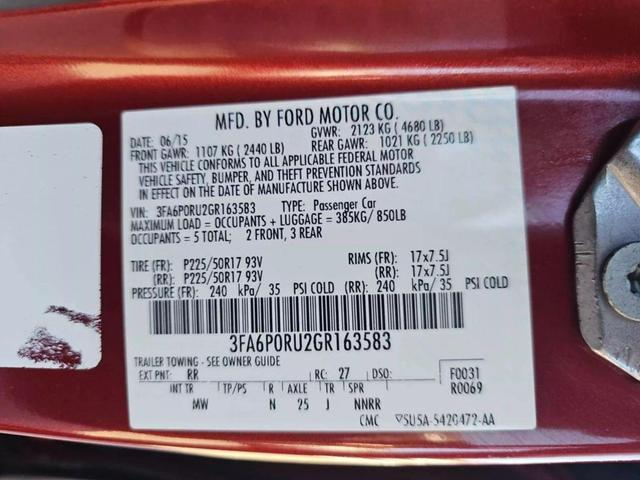 Photo of 2016 Ruby Red Metallic Tinted Clearcoat Ford Fusion Hybrid