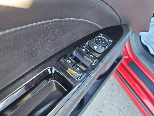 Photo of 2016 Ruby Red Metallic Tinted Clearcoat Ford Fusion Hybrid