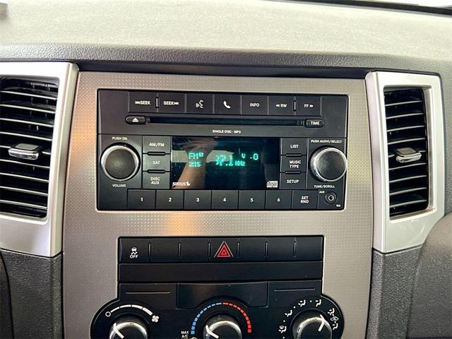 Photo of 2010 Inferno Red Crystal Pearlcoat Jeep Grand Cherokee
