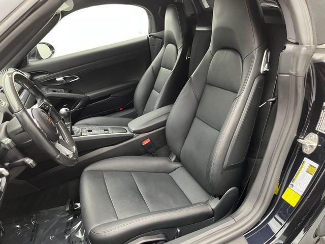 Photo of 2024 Jet Black Metallic Porsche 718 Boxster