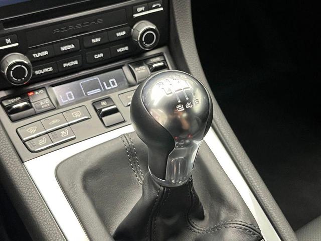 Photo of 2024 Jet Black Metallic Porsche 718 Boxster