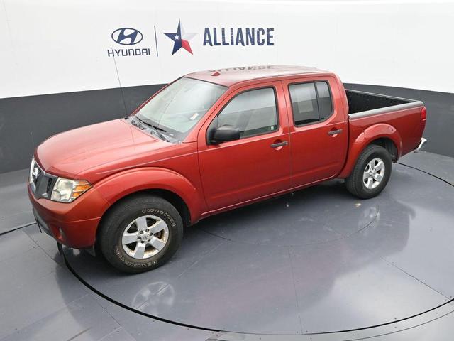 Photo of 2012 Lava Red Nissan Frontier
