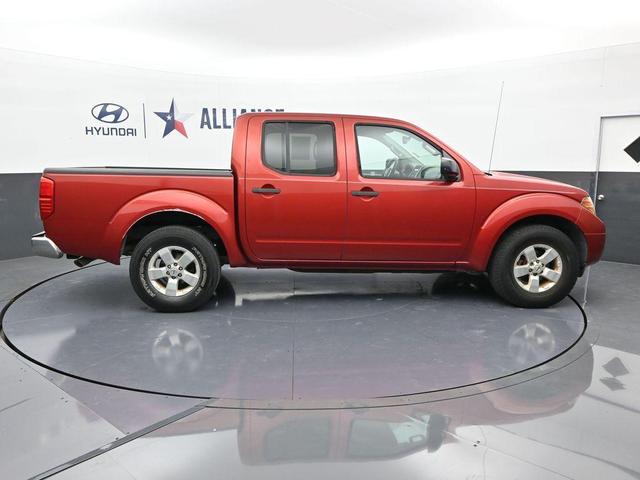 Photo of 2012 Lava Red Nissan Frontier