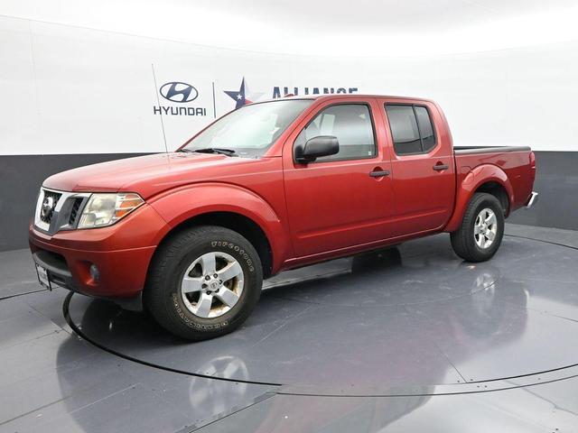 Photo of 2012 Lava Red Nissan Frontier