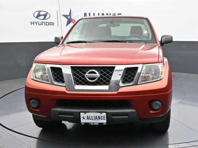 Photo of 2012 Lava Red Nissan Frontier