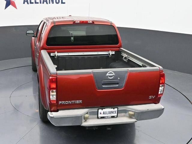 Photo of 2012 Lava Red Nissan Frontier