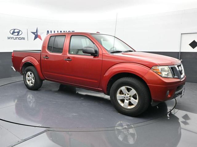 Photo of 2012 Lava Red Nissan Frontier