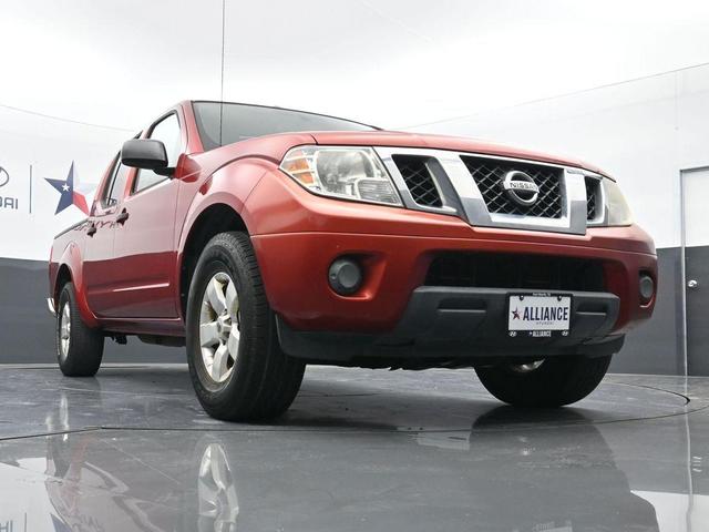 Photo of 2012 Lava Red Nissan Frontier