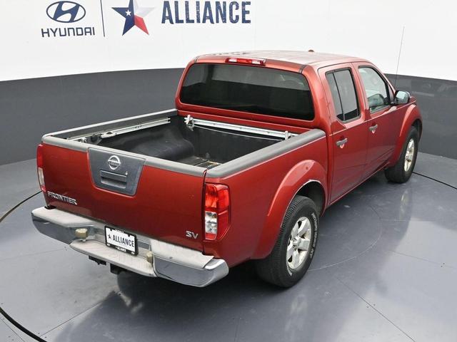 Photo of 2012 Lava Red Nissan Frontier