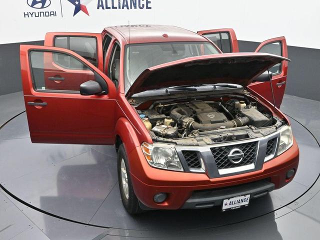 Photo of 2012 Lava Red Nissan Frontier