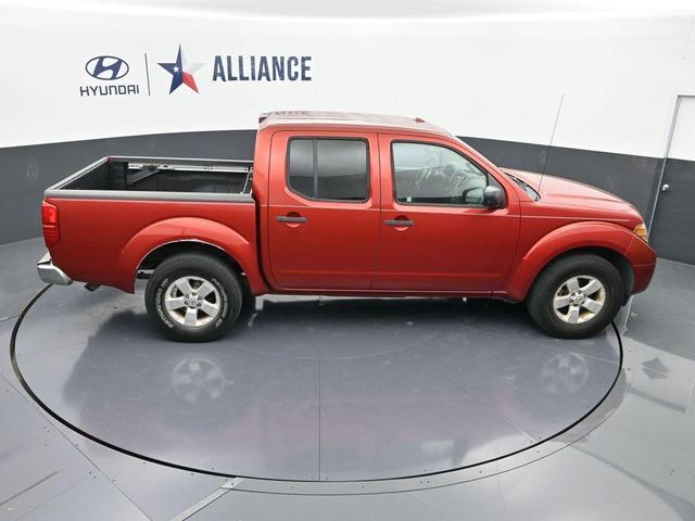 Photo of 2012 Lava Red Nissan Frontier