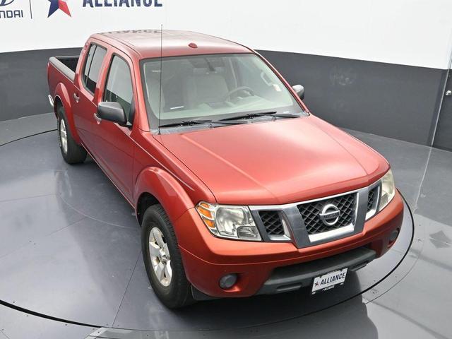 Photo of 2012 Lava Red Nissan Frontier