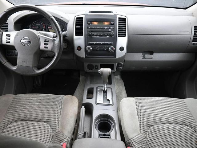 Photo of 2012 Lava Red Nissan Frontier
