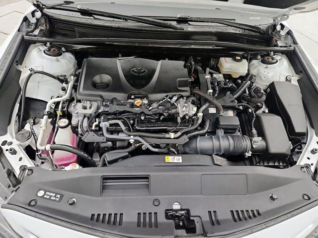 Photo of 2021 White Toyota Camry Hybrid