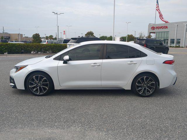 Photo of 2022 White w/Black Sand Pearl Roof Toyota Corolla
