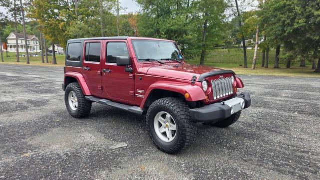 Photo of 2012 Deep Cherry Red Crystal Pearlcoat Jeep Wrangler Unlimited