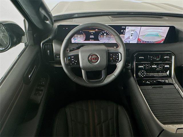 Photo of 2025 Aspen White Tricoat/Super Black Nissan Armada