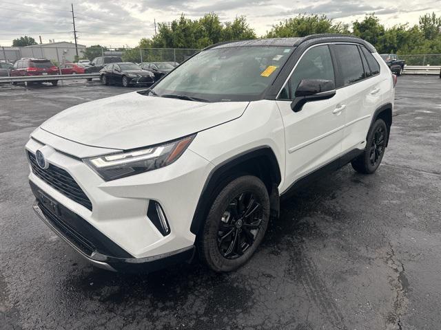 Photo of 2024 Wind Chill Pearl/Midnight Black Metallic Toyota RAV4 Hybrid