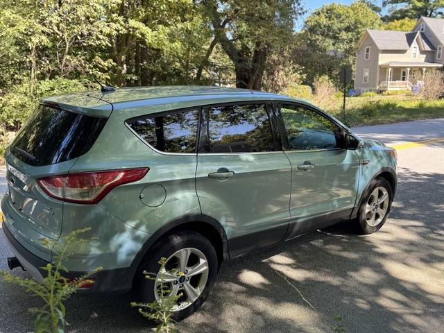 Photo of 2013 Turquoise Ford Escape