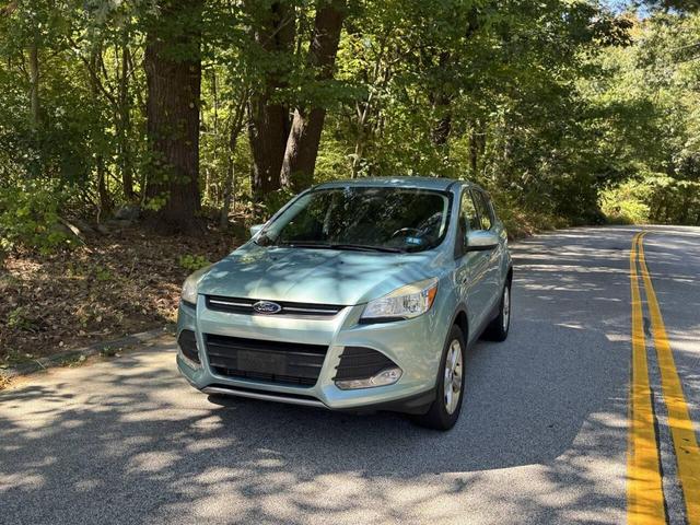 Photo of 2013 Turquoise Ford Escape