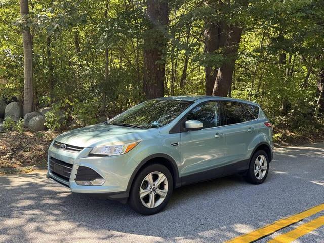 Photo of 2013 Turquoise Ford Escape