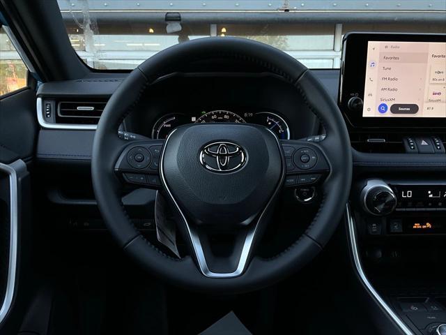 Photo of 2025 Cavalry Blue/Midnight Black Toyota RAV4 Hybrid