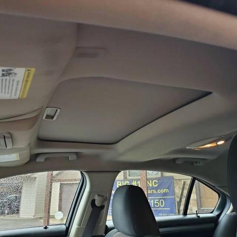 Photo of 2012 Cinnamon Metallic Ford Taurus