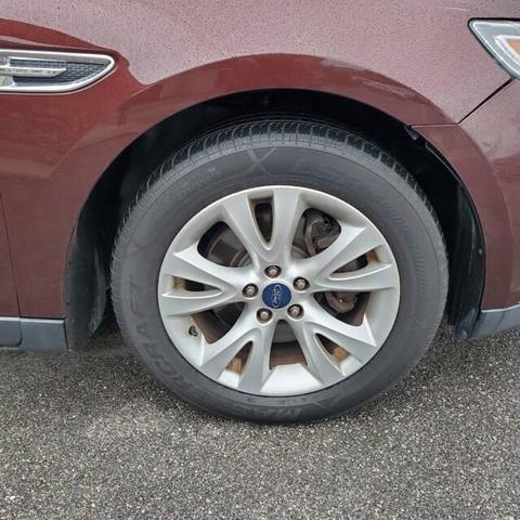 Photo of 2012 Cinnamon Metallic Ford Taurus