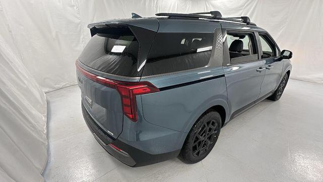 Photo of 2026 Astra Blue Kia Carnival Hybrid