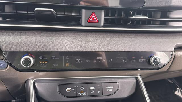 Photo of 2026 Deep Chroma Blue Kia Carnival Hybrid