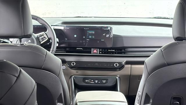Photo of 2026 Deep Chroma Blue Kia Carnival Hybrid