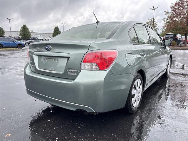 Photo of 2014 Jasmine Green Metallic Subaru Impreza