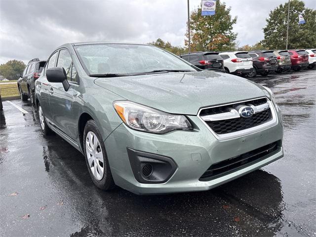 Photo of 2014 Jasmine Green Metallic Subaru Impreza