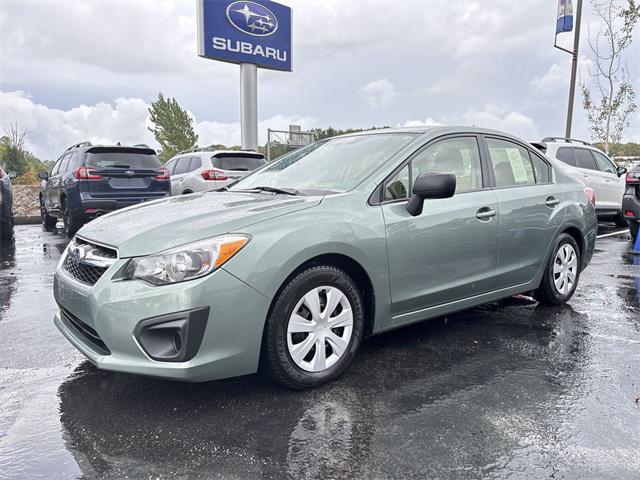 Photo of 2014 Jasmine Green Metallic Subaru Impreza