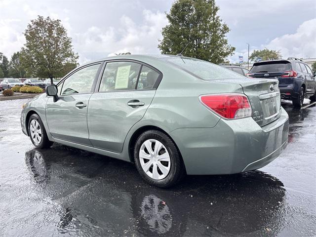 Photo of 2014 Jasmine Green Metallic Subaru Impreza