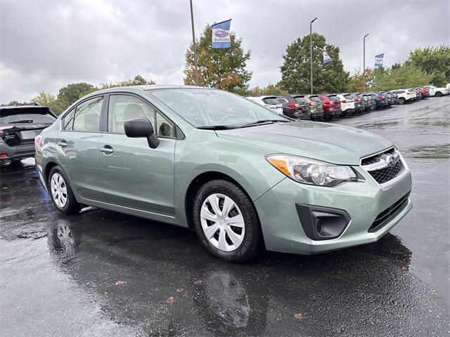 Photo of 2014 Jasmine Green Metallic Subaru Impreza