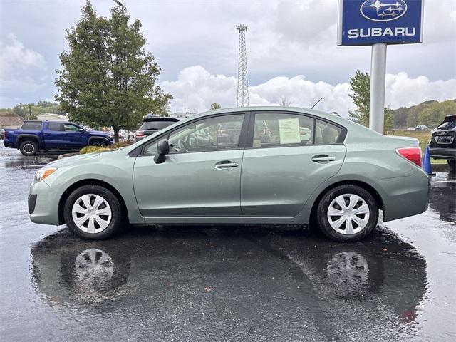 Photo of 2014 Jasmine Green Metallic Subaru Impreza