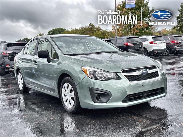Photo of 2014 Jasmine Green Metallic Subaru Impreza